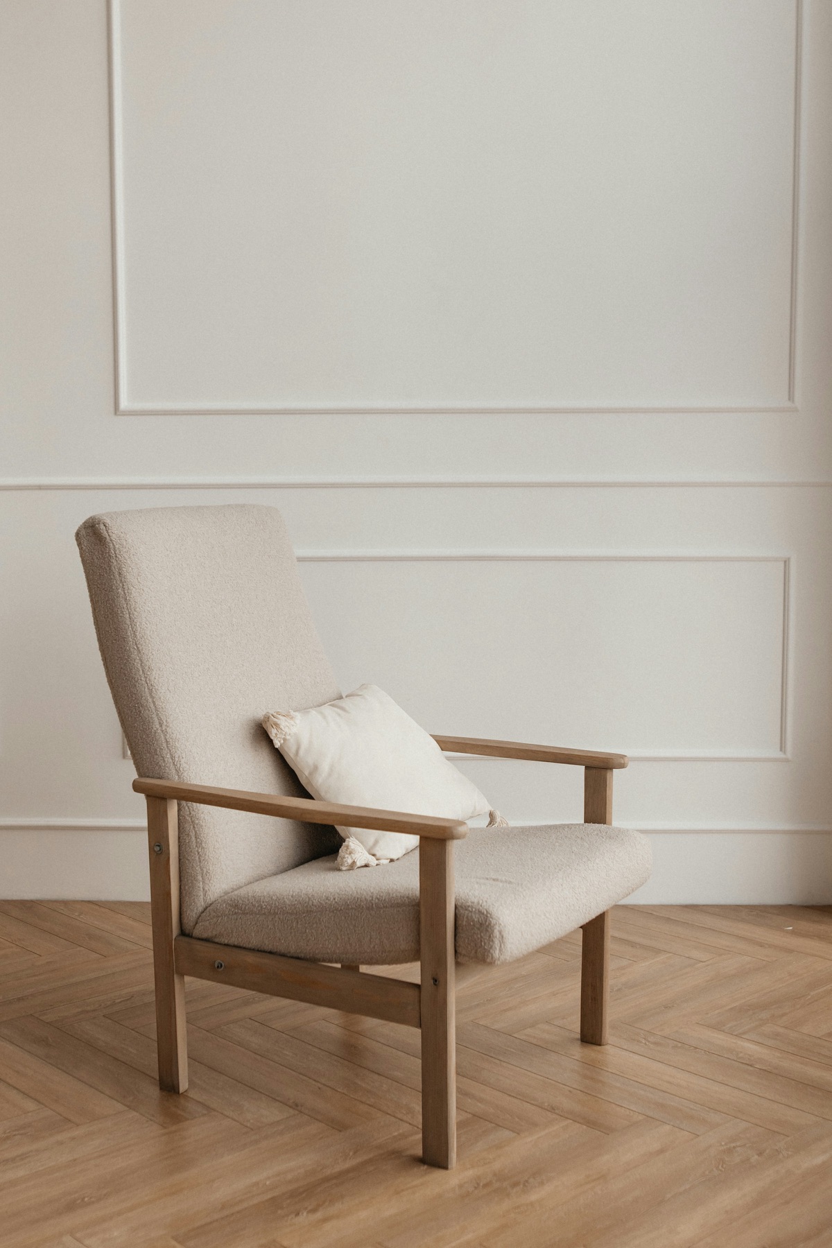 A quiet armchair in a softly lit room
